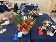 Floral Arrangement Table with Madison Davis’ 1st place entry centered 